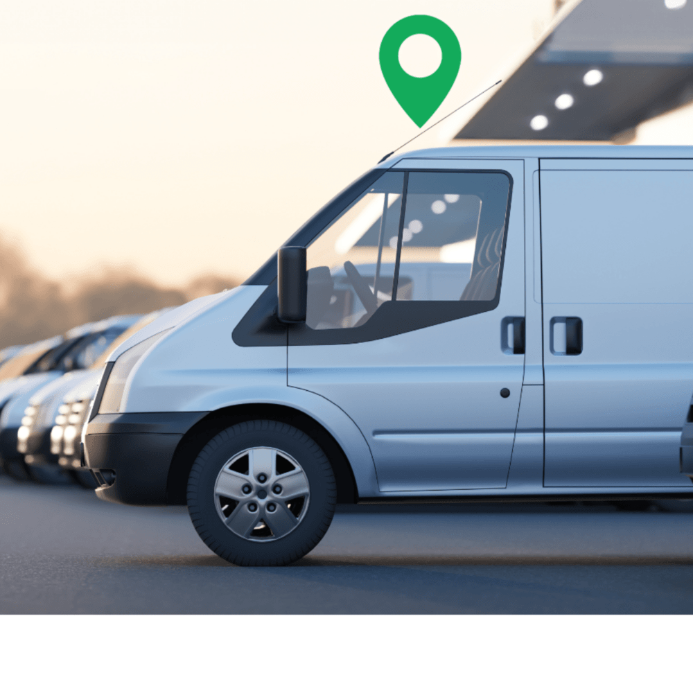 A white van is parked in a row of vehicles with a green location pin hovering above it.