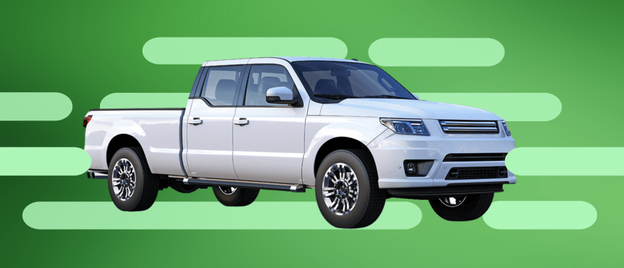 A white double cab pickup truck stands against a green background adorned with abstract shapes.