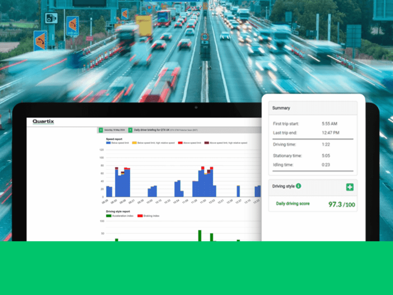 Dashboard displaying driving analytics and driver scores with charts and a summary screen on a computer; busy freeway in the background.